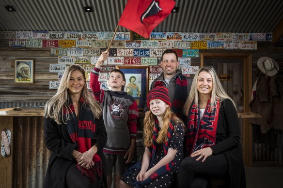 Melbourne legend Robbie Flower’s family - daughter Mikala, grandson Jett 12, granddaughter Ava 8, son Brad and daughter Emily Flower - are looking forward to seeing the Demons play in the grand final. 