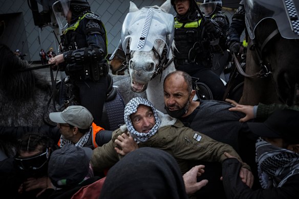 Anti-war protesters were confronted by Victoria Police as a Land Forces protest turned violent in 2024.