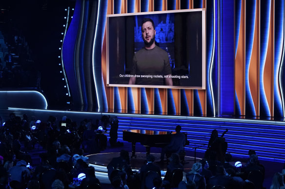 Ukraine President Volodymyr Zelensky, speaks on screen at the 64th Annual Grammy Awards.