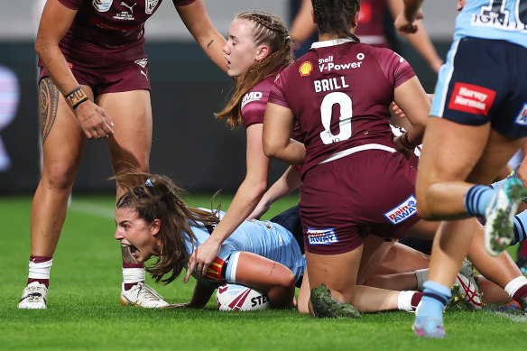 Jessica Sergis dives over for the Sky Blues against Queensland on Thursday night.
