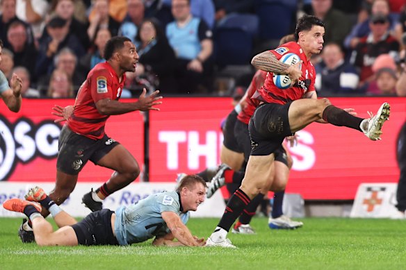 Rivez Reihana of the Crusaders makes a break. 