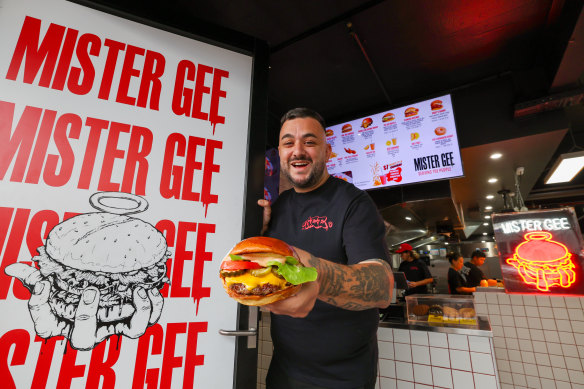 Mister Gee founder Gee Ozgen with a “Cheese Boogie Deluxe” at his restaurant in North Strathfield.
