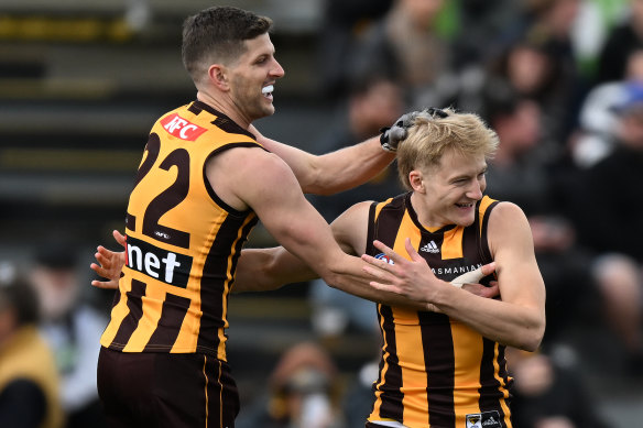 Jack Saunders and Luke Breust celebrate a goal.