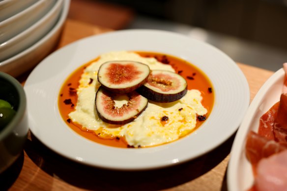 Fig-garnished stracciatella on chilli oil.
