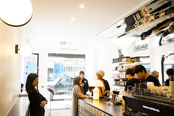 Reflective surfaces and soft lighting inside Bench Coffee.