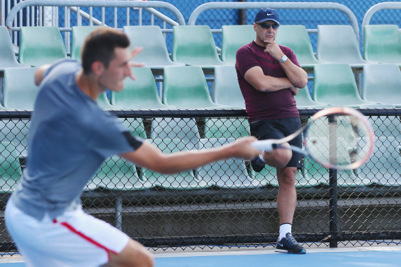 John Tomic watches on as his son Bernard trains during the 2016 Australian Open.