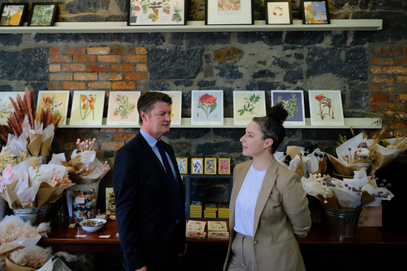 Employment Minister Ben Carroll with Melanie Neal manager Zetta Florence. Carroll said it was unlikely that businesses would be taxed to continue funding the scheme beyond the two-year trial.