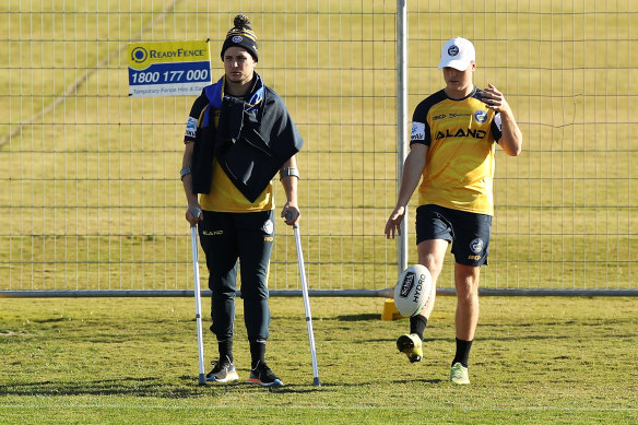 Injured halfback Mitchell Moses (left) alongside Jai Field at Eels training this week.