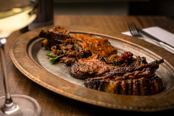 Lamb khorovats – grilled cutlets with harissa and labne.