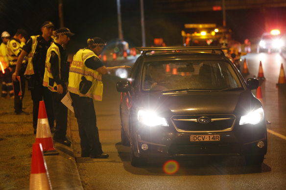 Police set up a road block near the Queensland-NSW border on Thursday morning. 