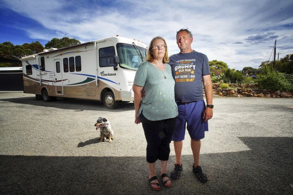 Monica and Aaron Benney with
dog Pepper in front of their motorhome in Melton on Saturday. 


