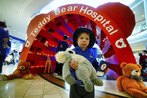 Please look after this bear: Felix Strong, 2, with his toy koala Koolala at the entrance to the Teddy Bear Hospital at Chadstone Shopping Centre.