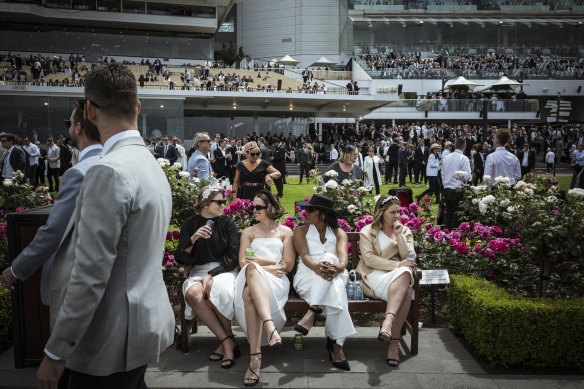 Punters enjoy the sun at Flemington.