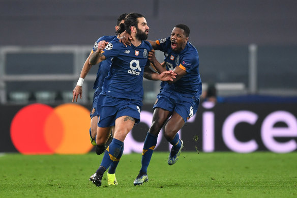 Sergio Oliveira celebrates after scoring a crucial late goal against Juventus.