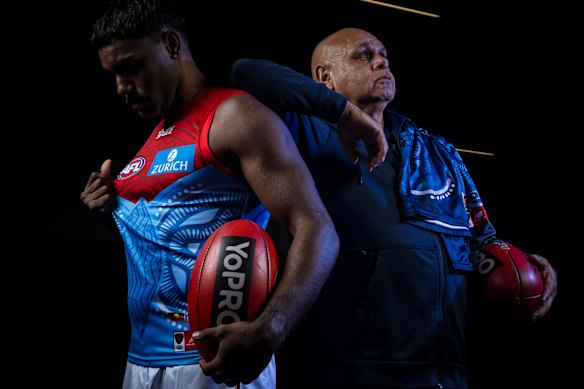 Kysaiah Pickett with his dad, Kevin Kropinyeri, who designed the Demons’ Indigenous jumper.