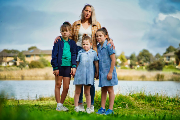 Allison Wooles and daughters Roberta, 10, Grace, 7, and Madeline, 5, want plans for a local high school revived.