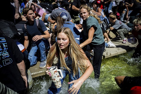The crowd reacts after the shooting.