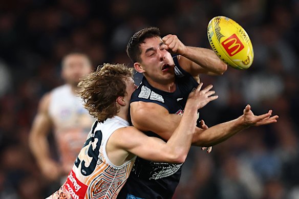 Adam Cerra handballs under pressure.