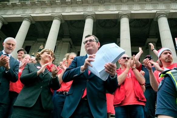 December 2013: Holding a petition outside of Parliament House.