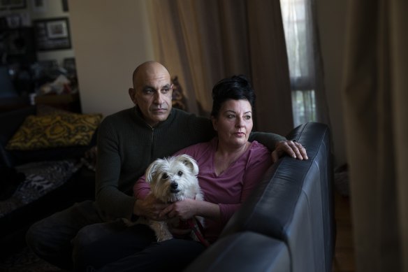 Greg Sposaro - pictured with his partner Cynthia Windsor and their dog Coco - says he was scared by the police officers that came to his home.