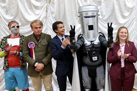 Count Binface, centre, and some of the other 34 candidates for the seat of Clacton.