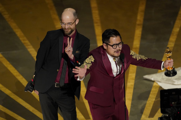 Daniel Scheinert (left) and Daniel Kwan accept the award for best original screenplay.