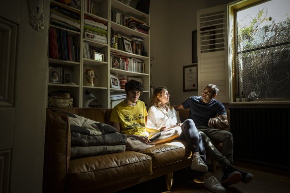 Elisa Hill and Phillipe Yardin enjoying the late afternoon sunlight in their home with their son Jai, who has severe autism. 