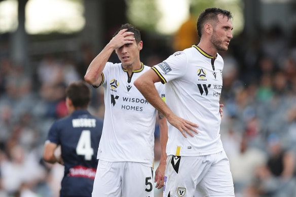 Mark Milligan and Aleksandar Susnjar after the Mariners' second goal condemned Macarthur FC to a first A-League defeat.
