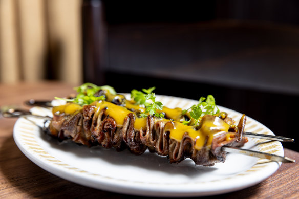 Ox-tongue skewers with mustard dressing.