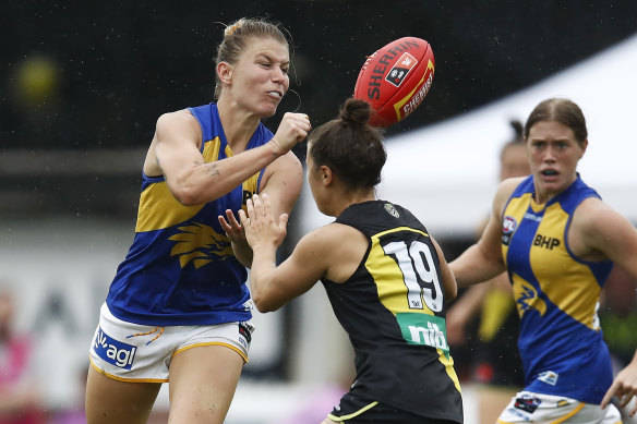 West Coast’s Kellie Gibson, left, passes the ball. 