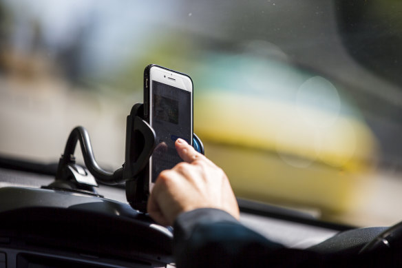 There are perfectly legal reasons to use phones while driving, as long as they are in cradles. 