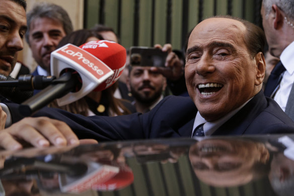 Silvio Berlusconi is mobbed by press as he leaves a reunion to decide the group leaders of at the Lower Chamber, in Rome.