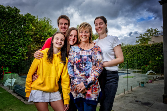 Retired but returning: Former critical care nurse Debbie Andrews with her children Tess, 12, Braden, 17, Tara, 19, and Steph, 21, at home in Canterbury.
