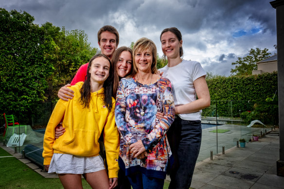 Retired but returning: Former critical care nurse Debbie Andrews with her children Tess, 12, Braden, 17, Tara, 19, and Steph, 21, at home in Canterbury.