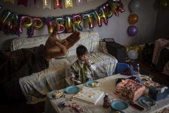 Ro Say Htoo gorges on his brother’s birthday cake.