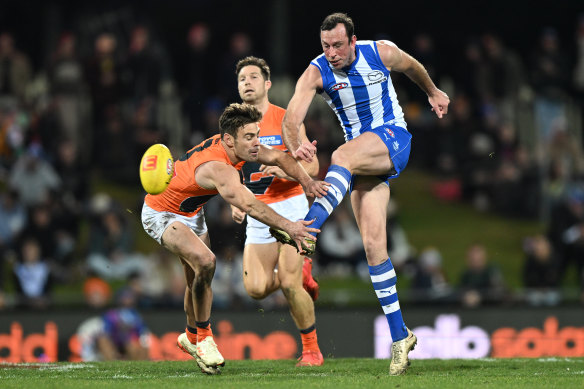 Todd Goldstein gets a kick away for the Kangaroos.