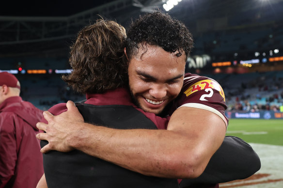 Xavier Coates and Reece Walsh of the Maroons celebrate their 38-10 win. 