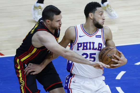Atlanta’s Danilo Gallinari tries to steal the ball from Ben Simmons.