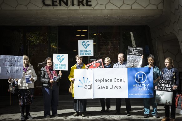 Public healthcare workers gathered outside AGL’s annual investor meeting in Melbourne calling for a faster exit from coal.