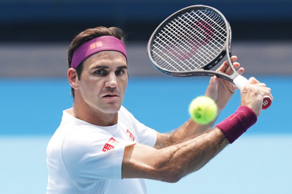 Federer volleys during an Australian Open practice session at Melbourne Park.