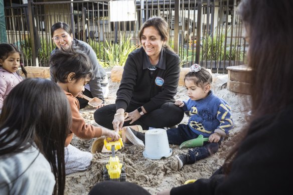 Early childhood educators Sumi Chowdhury, Ptiyanka Chopra and Nidhi Katyal with the children they teach at Goodstart Early Learning in Flemington.