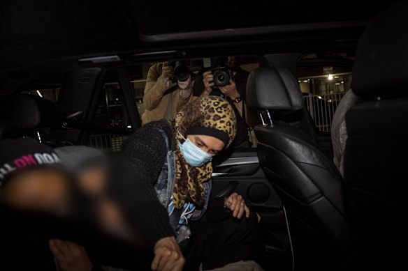 Islamic State-linked woman Kirsty Rosse-Emile gets into a car after arriving at Melbourne international Airport, in Melbourne.