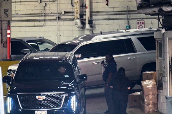 A silver SUV thought to be ferrying Taylor Swift arrives at the venue on Thursday night (Friday morning AEST).