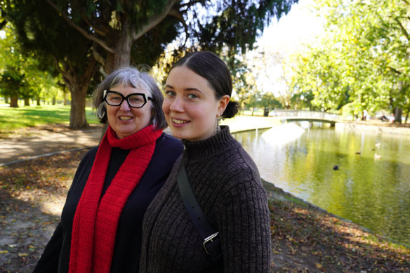 Sue Hallams and her daughter, Phoebe Foldvari, at  Caulfield Park lake, where they were once chased by the geese. 