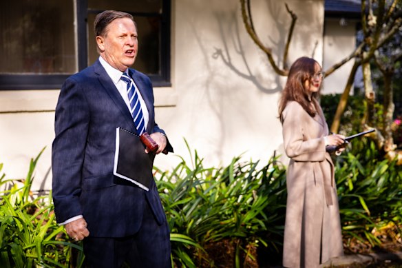 Auctioneer Michael Walter runs proceedings at Tanderra Street.