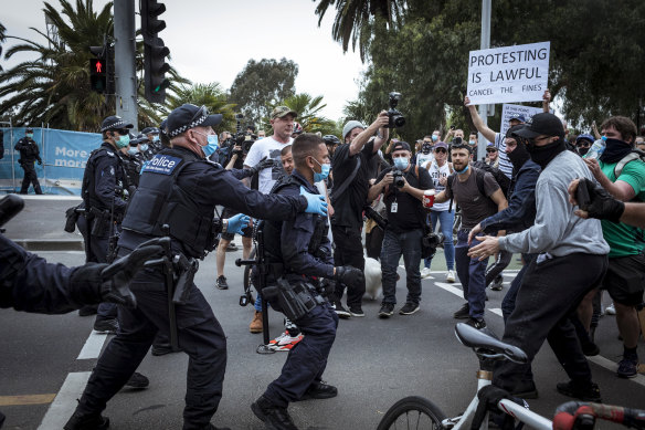 Police and protesters clashed at the 'Freedom Day' protest outside the NGV.