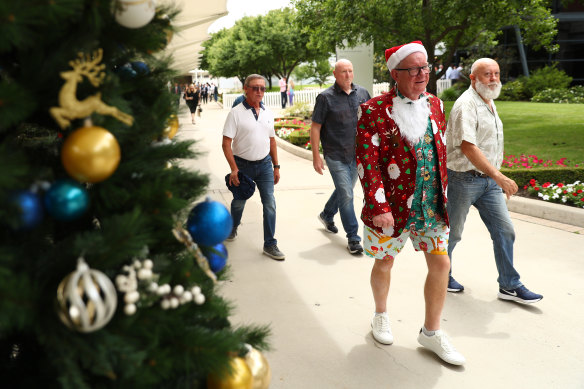 Racegoers arrive at Rosehill for Festival Stakes Day last Saturday. Meanwhile, senior personnel were working on a deal to redevelop the track.