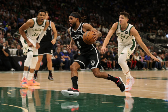 Patty Mills in action on debut for the Nets.
