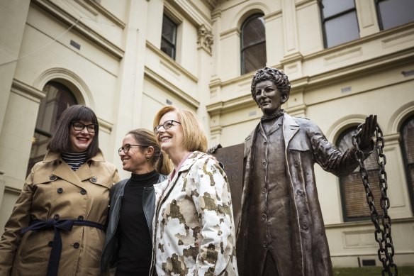 Former prime minister Julia Gillard (right) with Kristine Ziwica and Professor Clare Wright from A Monument of One’s Own, in front of Mann’s statue of activist Zelda D’Aprano at Trades Hall.