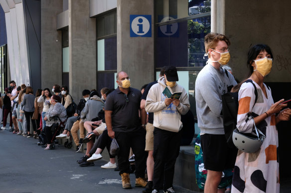 People line up outside the Royal Melbourne Hosital for coronavirus testing.